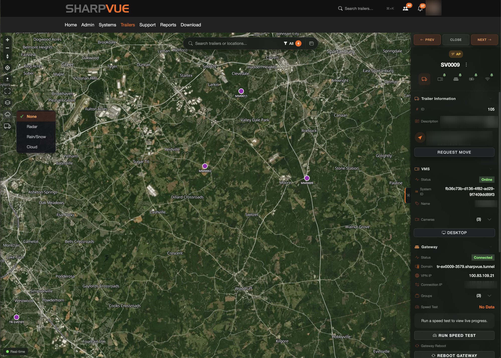 The MySharpvue fleet map zoomed into a region on satellite imagery, with unit pins and a trailer detail panel showing VMS online, gateway connected, cameras, a Request Move button, speed test, and gateway reboot controls.