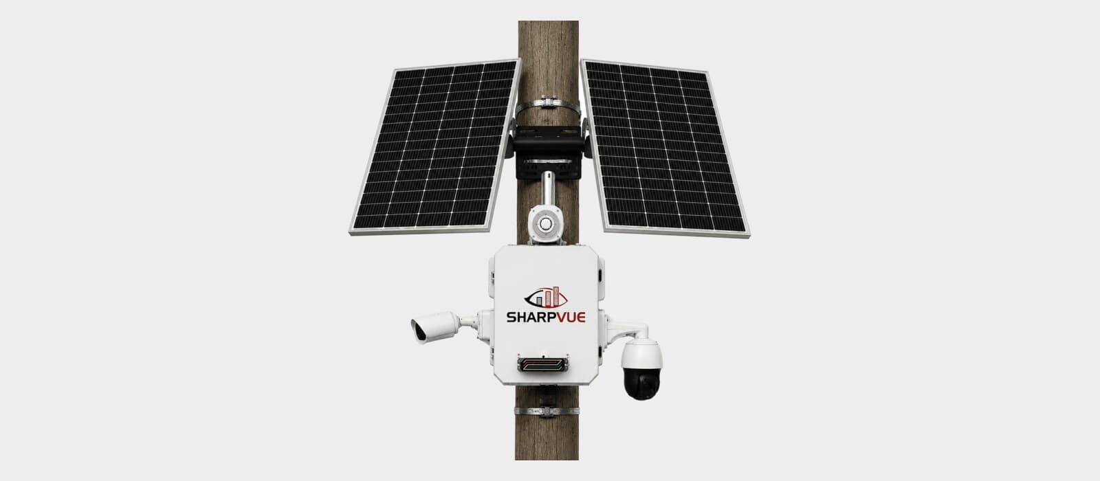 The Sharpvue Solar Portable Surveillance Unit clamped to a wooden utility pole, with dual solar panels, a fixed bullet camera, and a PTZ dome.