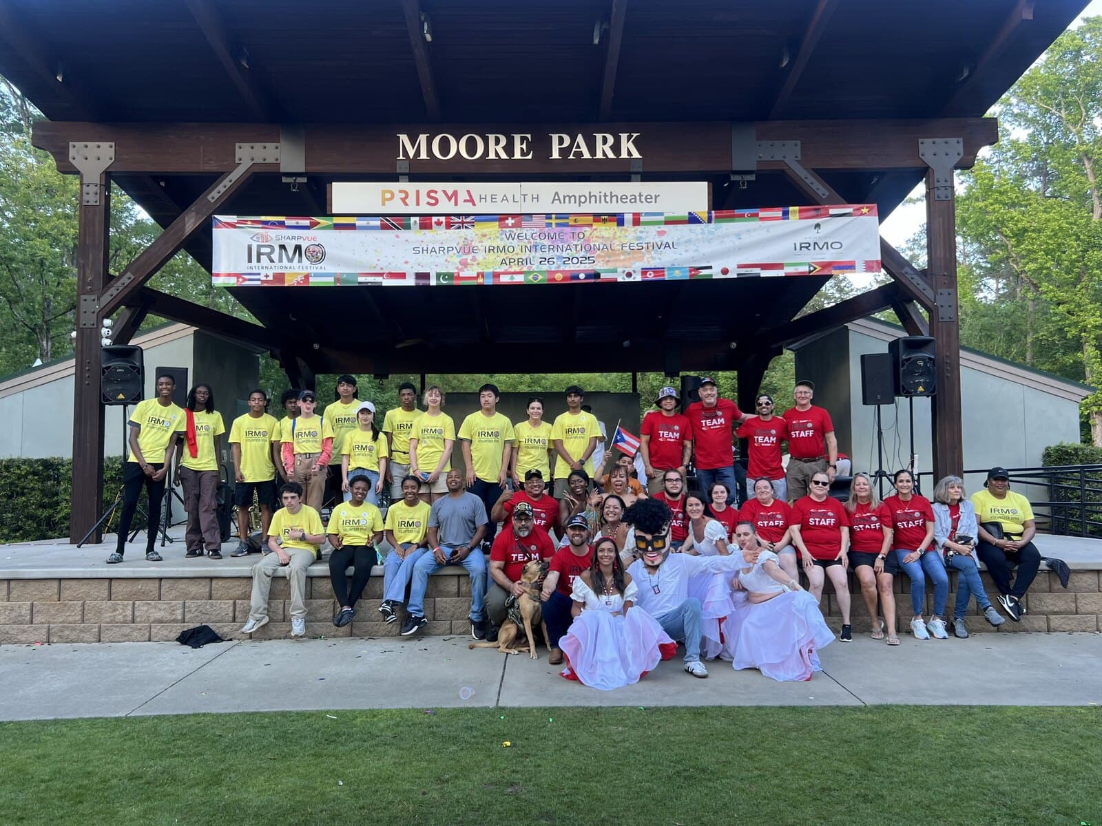 The full Sharpvue team and Irmo International Festival staff gathered at Moore Park Amphitheater in Chapin, South Carolina.
