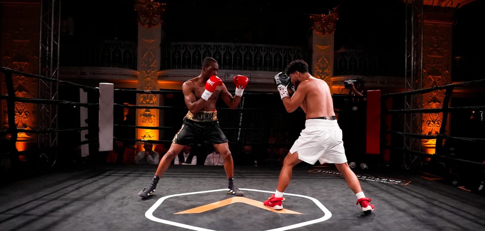 Two boxers squaring off in the ring at the Alarm.com Fight Night